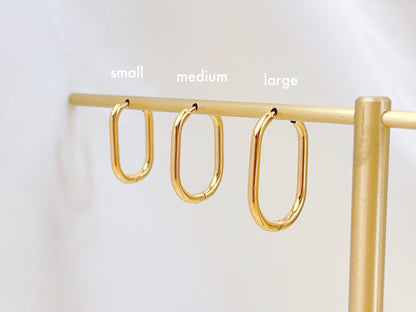 E080 gold oval rectangular hoops