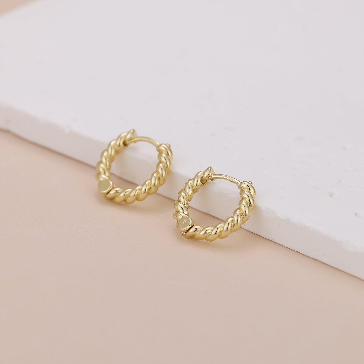 E118 gold twisted huggie hoop earrings