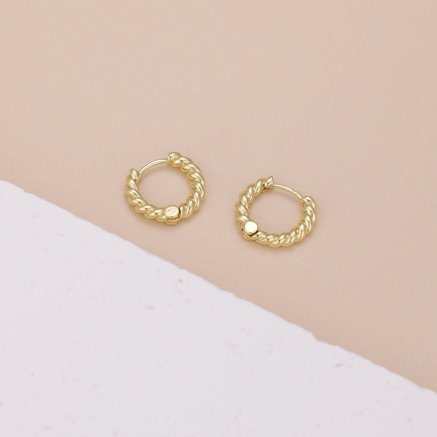 E118 gold twisted huggie hoop earrings