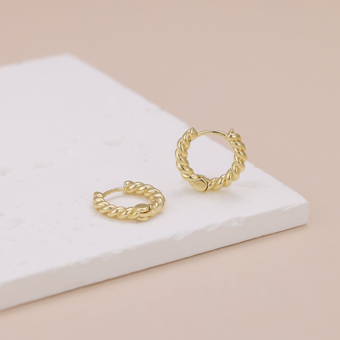 E118 gold twisted huggie hoop earrings