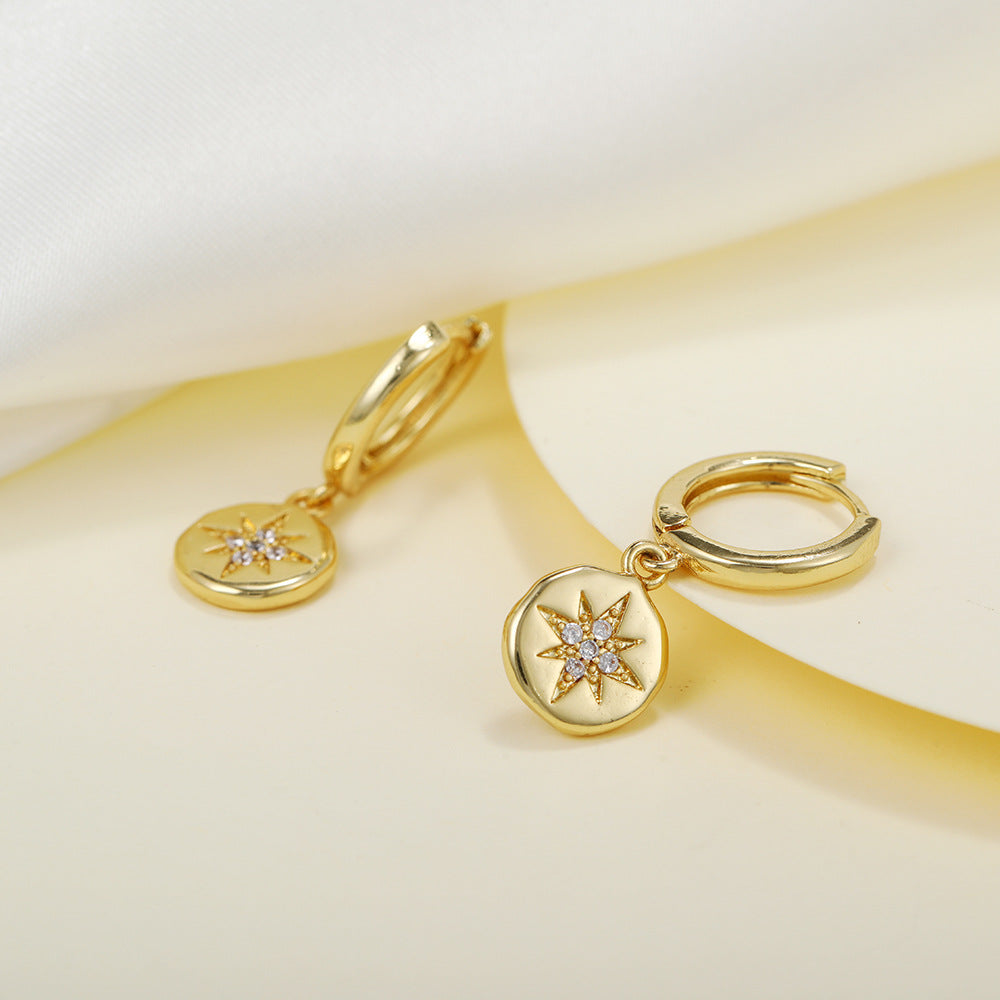 E056 gold starburst dangle earrings