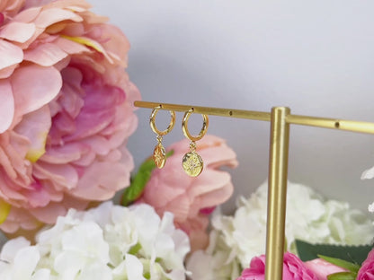 E056 gold starburst dangle earrings